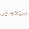 Boucles d'oreilles fleurs papillon couleur dorée - Lot de 9