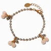 Bracelet à breloques cerises nacrées avec chaîne de strass couleur dorée