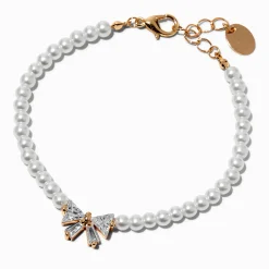 Bracelet chaîne couleur dorée perle d'imitation et nœud en zircon cubique